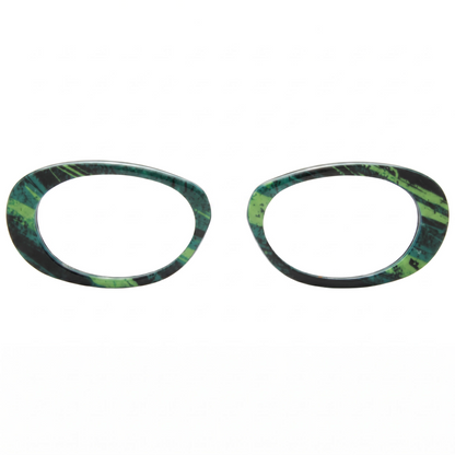 Two green and black patterned circular objects on a white background